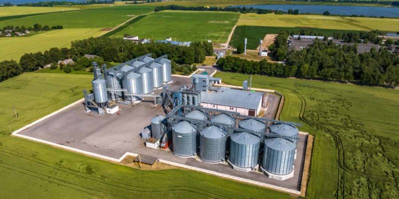 aerial-view-agro-silos-granary-elevator-with-seeds-cleaning-line-agroprocessing-manufacturing-plant-processing-drying-cleaning-storage-agricultural-products-flour-grain